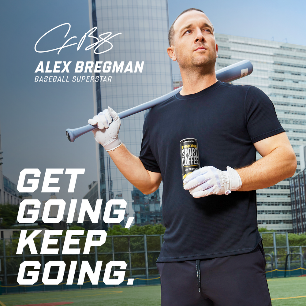 A man in sportswear holds a bat and a can of Coffee Latte on a city baseball field. Text reads: ALEX BREGMAN BASEBALL SUPERSTAR. GET GOING, KEEP GOING. Tall buildings are visible in the background.