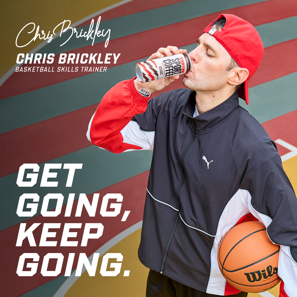 A man in a black Puma jacket and red cap drinks from a can of Mocha Cocoa and holds a basketball on an outdoor court. Text reads: GET GOING, KEEP GOING. and Chris Brickley, Basketball Skills Trainer.