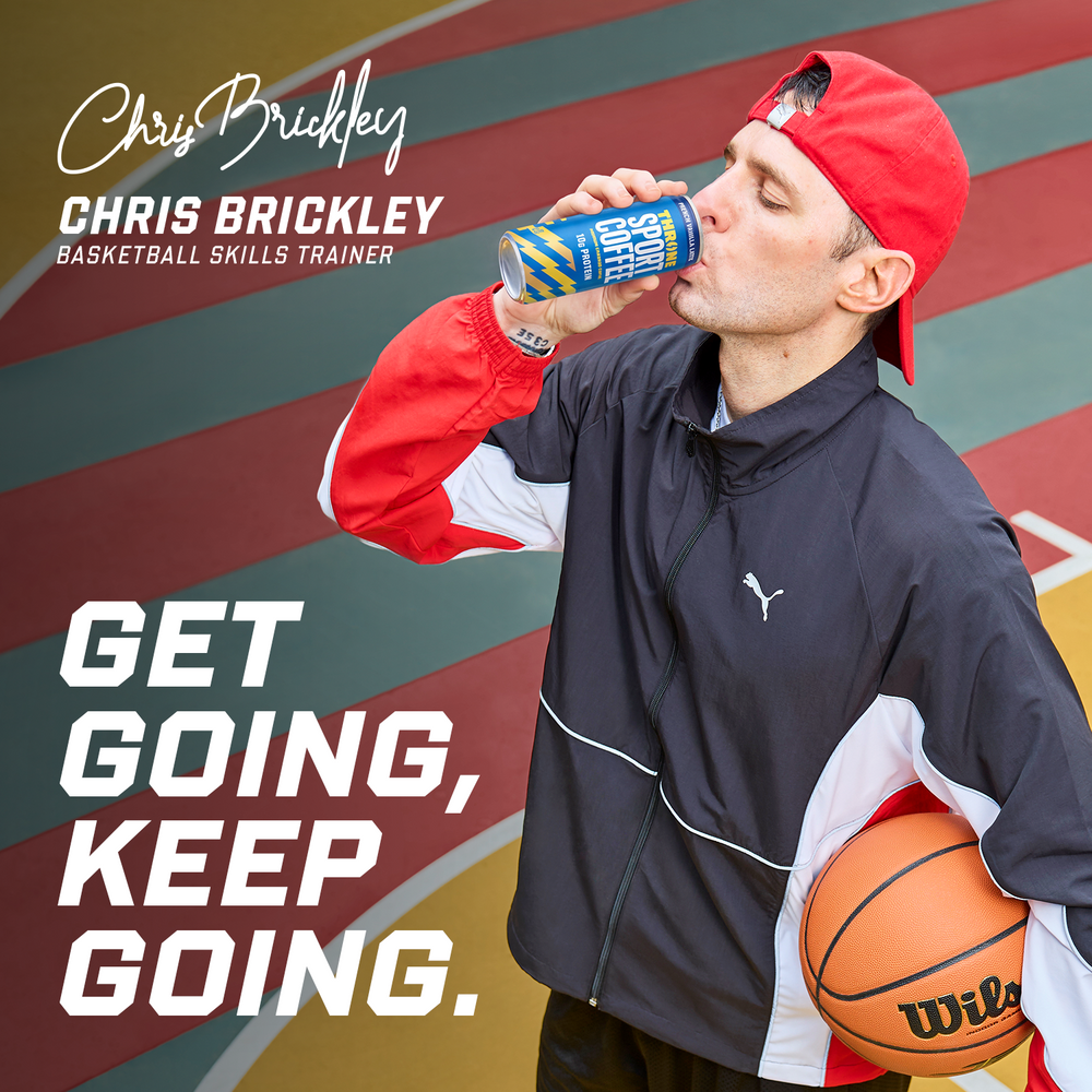 A man in a red cap and black Puma jacket drinks a can of French Vanilla Latte protein coffee while holding a basketball on an outdoor court. Text reads: Chris Brickley, Basketball Skills Trainer. Get going, keep going.
