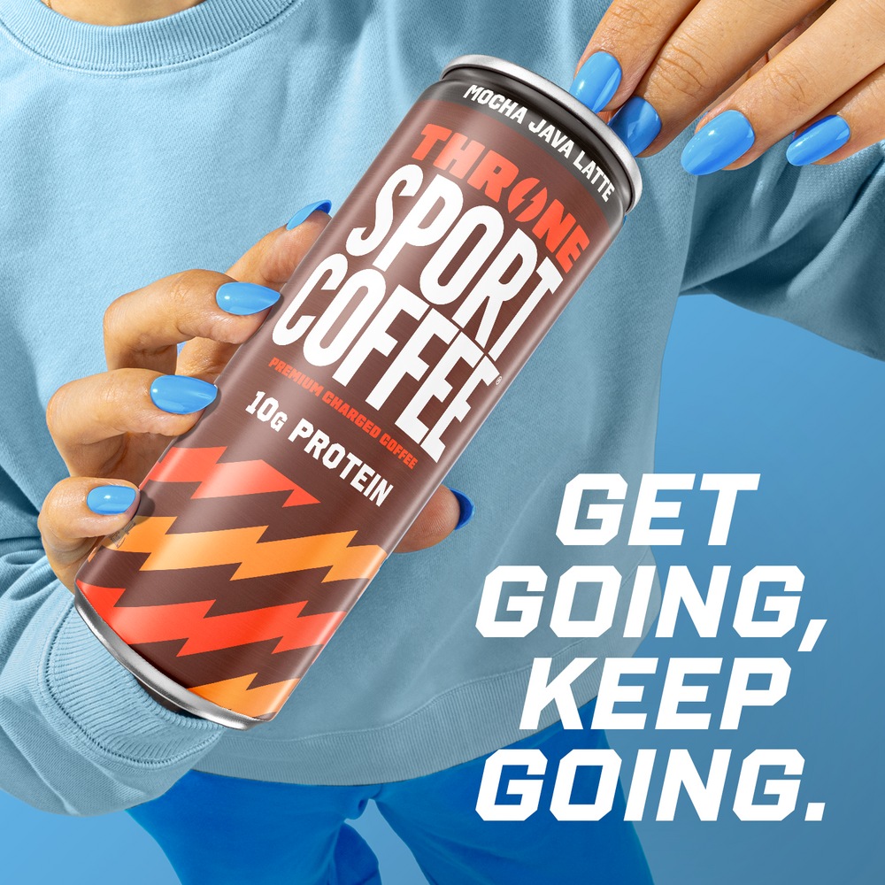 A person with blue nails holds a can of Mocha Java Latte made with lactose-free milk. The can reads “Mocha Java Latte” and “10g protein.” Text beside the can on a blue background says, “Get going, keep going.”.